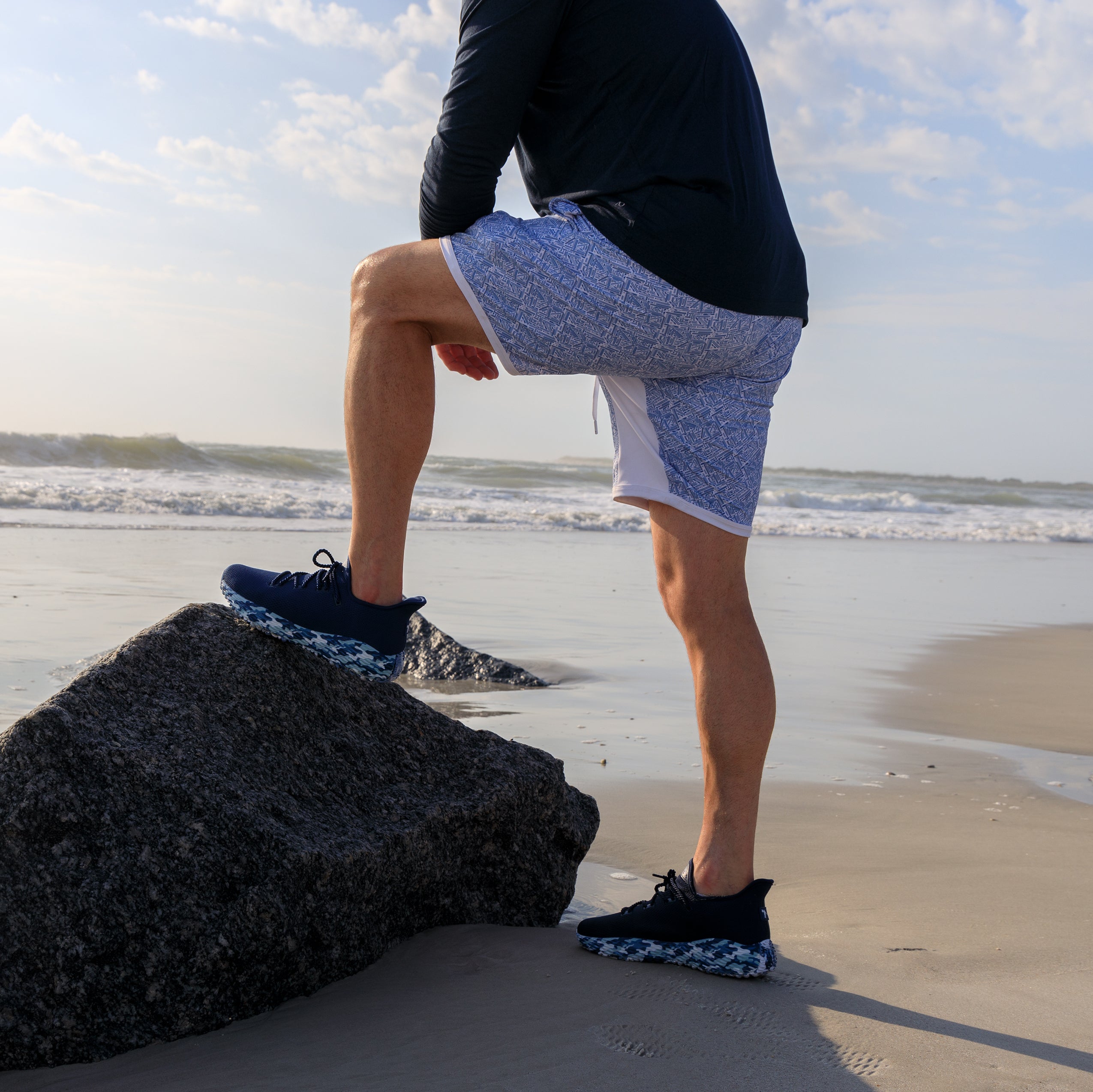 Blue Athletic Performance Shoe. Man wearing the best golf shoes on a beach. Blue camo pickleball shoes