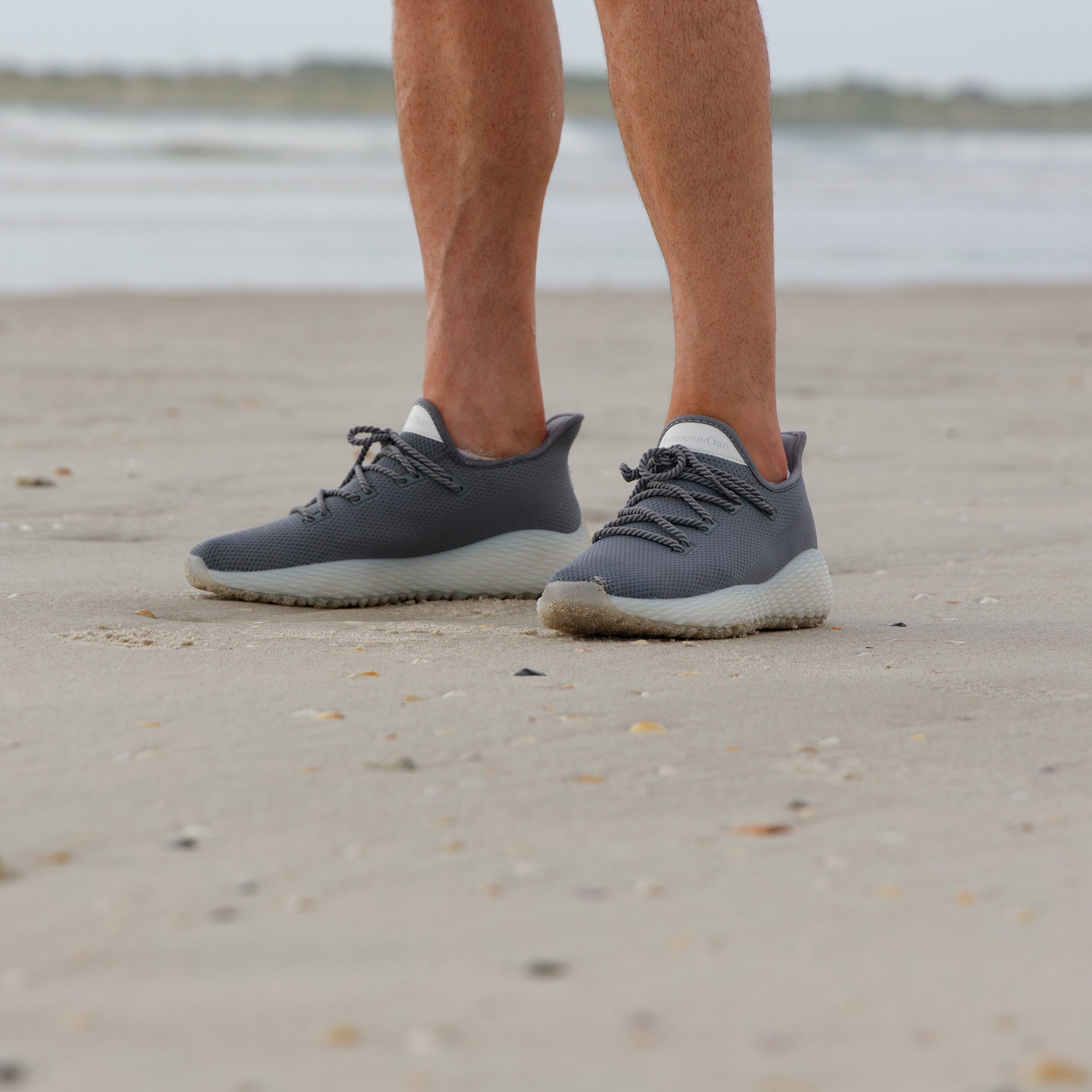 Man wearing Grey Running Shoes on the beach. AO Performance Golf Shoe. Grey Athletic Running Shoe.
AO Wave1 Perfect Pickleball Shoe