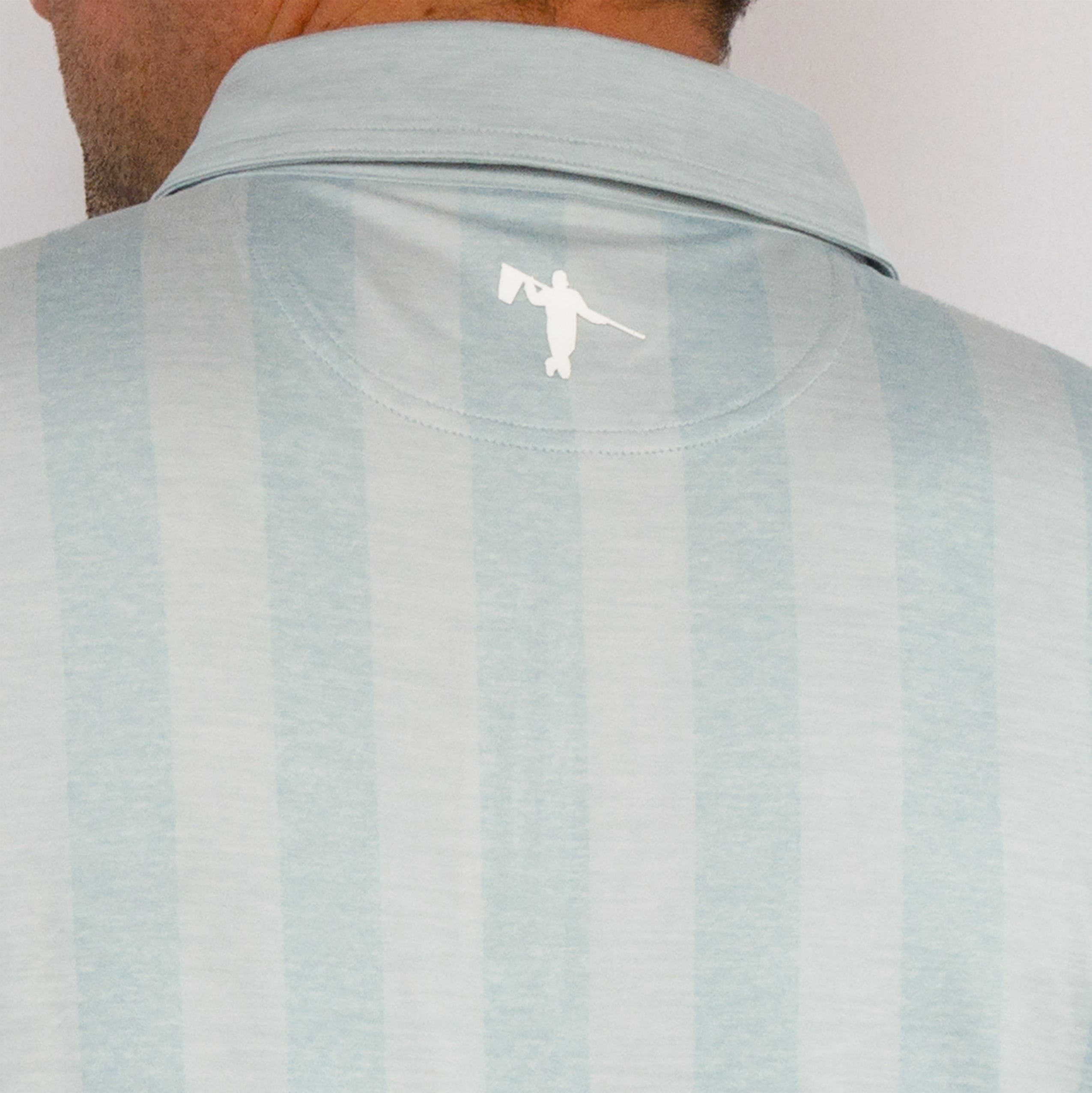 Man wearing athletic golf polo on blank background. Mens Golf Polo in LIght Blue with Vertical Stripes. Mens Fashion Luxury Golf Polo. AndersonOrd Golf Polo for Men