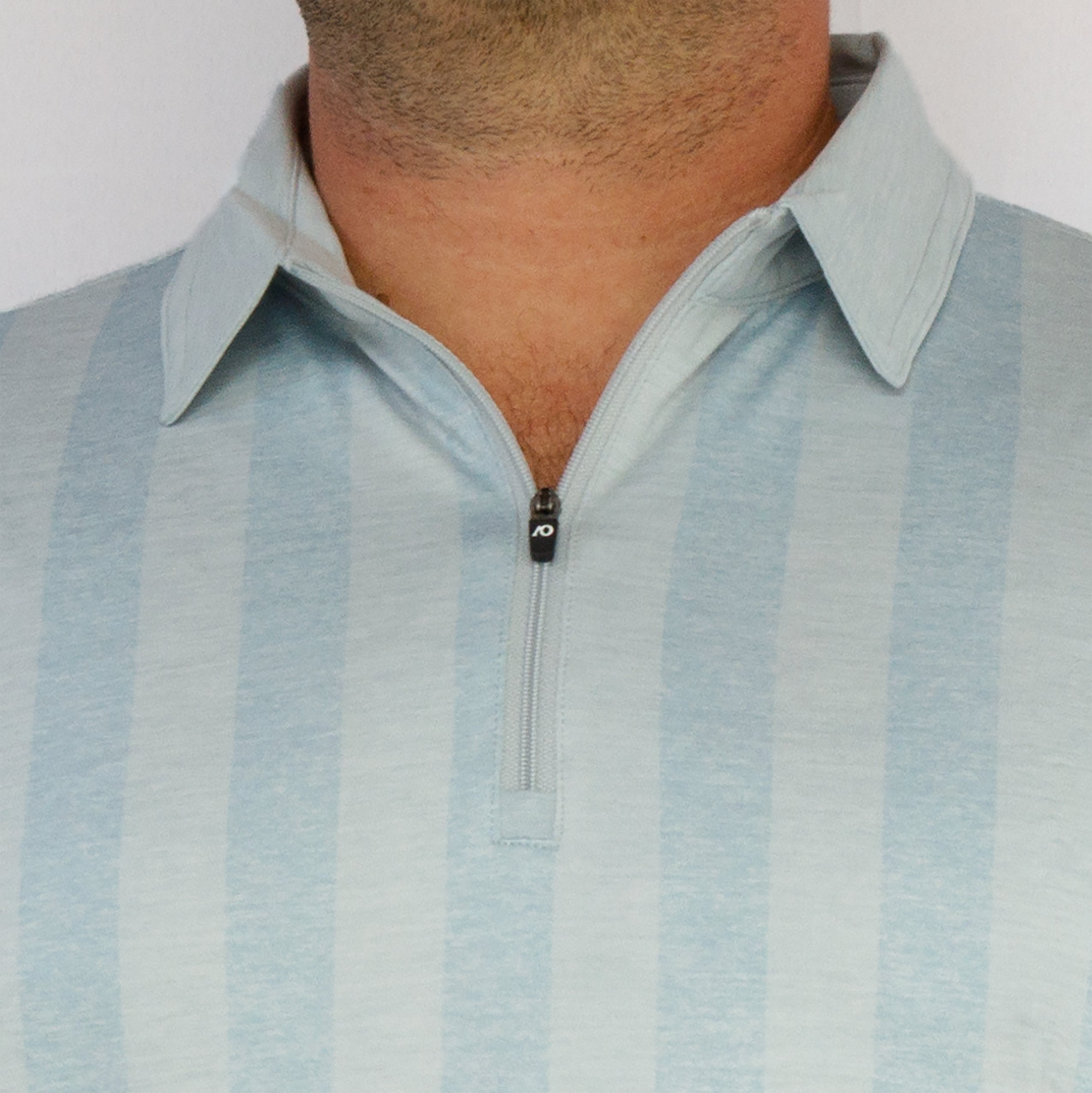 Man wearing athletic golf polo on blank background. Quarter zip polo. Mens Golf Polo in LIght Blue with Vertical Stripes. Mens Fashion Luxury Golf Polo. AndersonOrd Golf Polo for Men